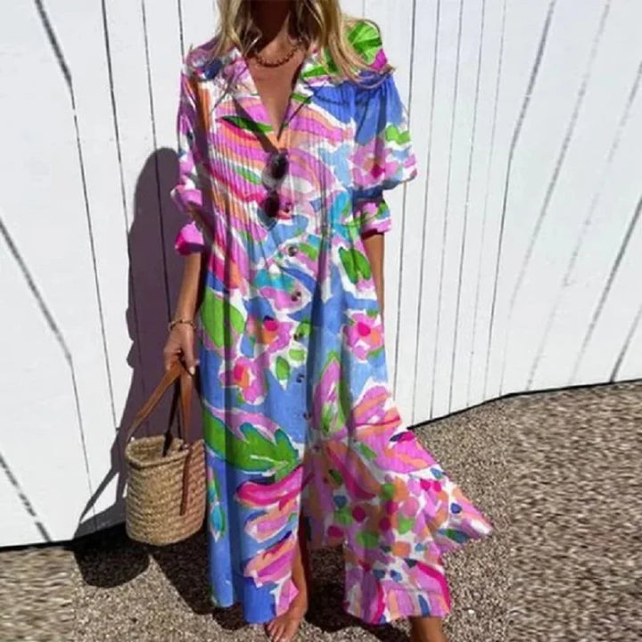V-neck long sleeve maxi dress in vibrant floral pattern with front slit detail