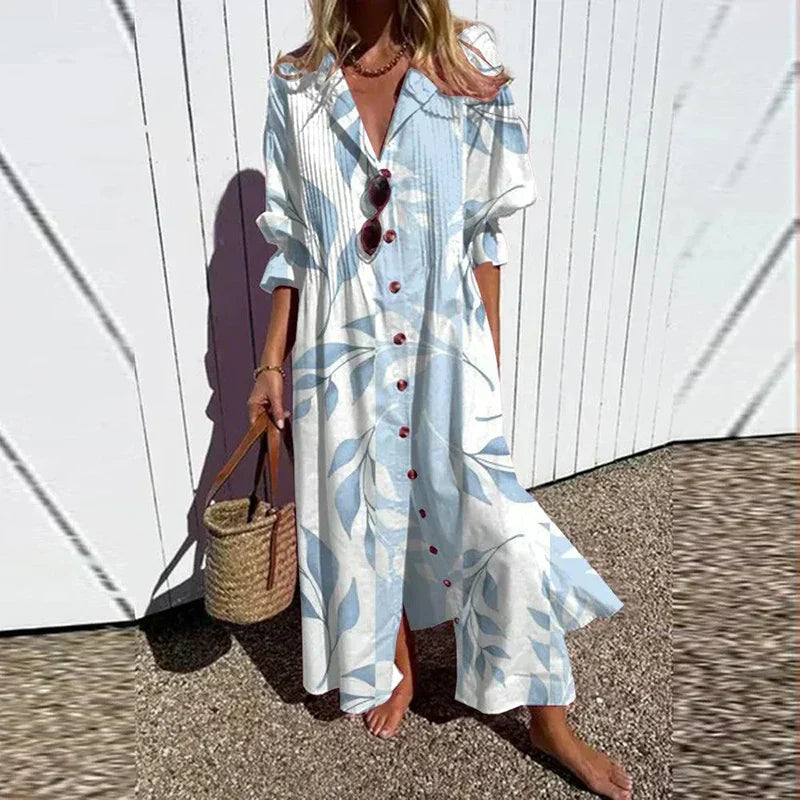 Women's floral maxi dress featuring V-neckline, long sleeves, and flowing skirt