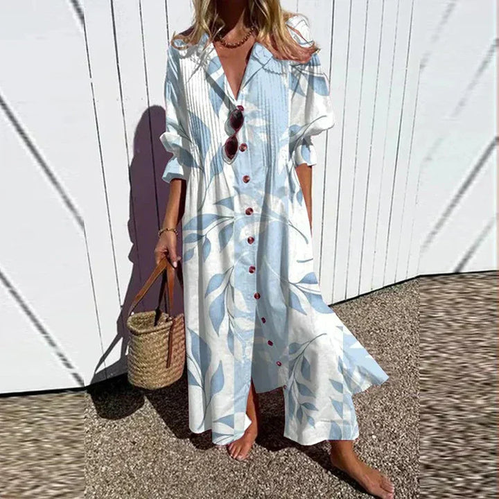 Women's floral maxi dress featuring V-neckline, long sleeves, and flowing skirt