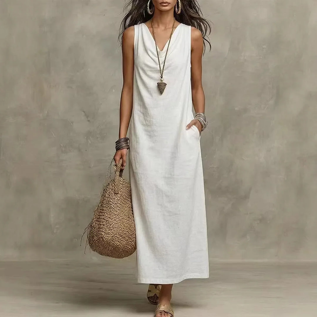 Woman wearing white Linen Sleeveless Maxi Dress Regular Price with V-neckline and relaxed flowing silhouette