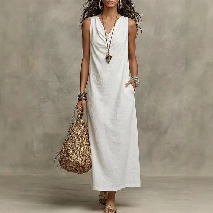 Woman wearing white Linen Sleeveless Maxi Dress Regular Price with V-neckline and relaxed flowing silhouette