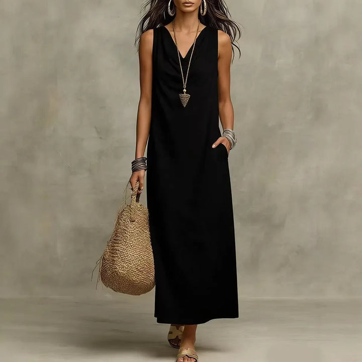 Side angle of flowing maxi dress with natural fabric texture and ankle-length hem