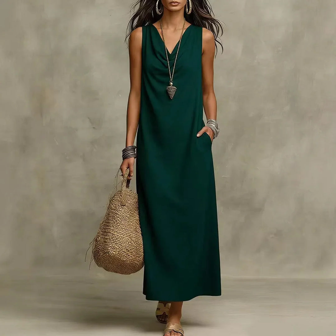 Detail shot of V-neckline and sleeveless construction on relaxed maxi dress