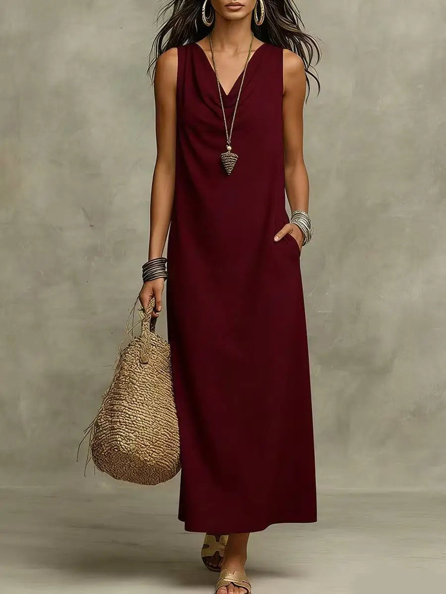 Full-length view of white maxi dress styled with sandals and woven bag