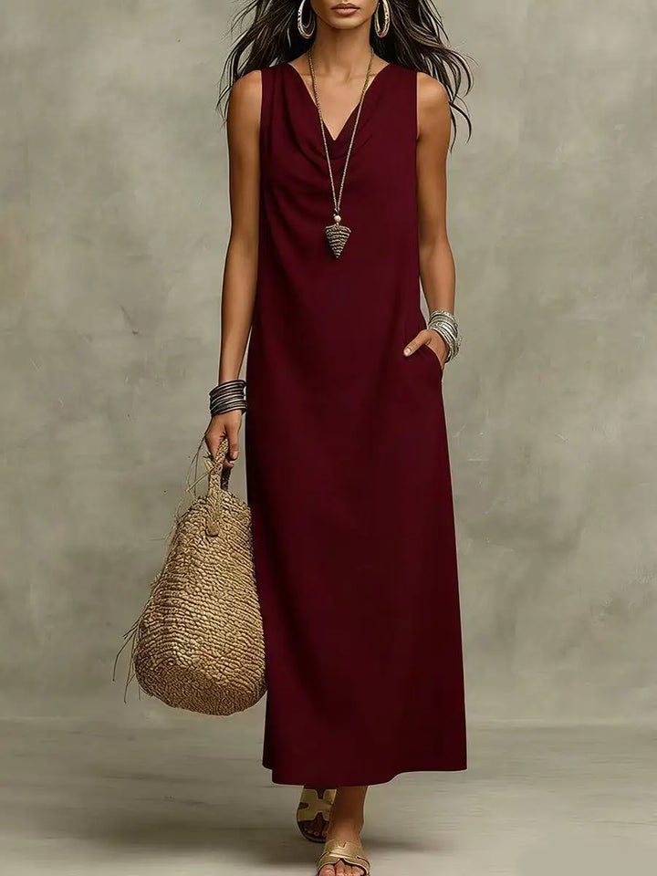 Full-length view of white maxi dress styled with sandals and woven bag