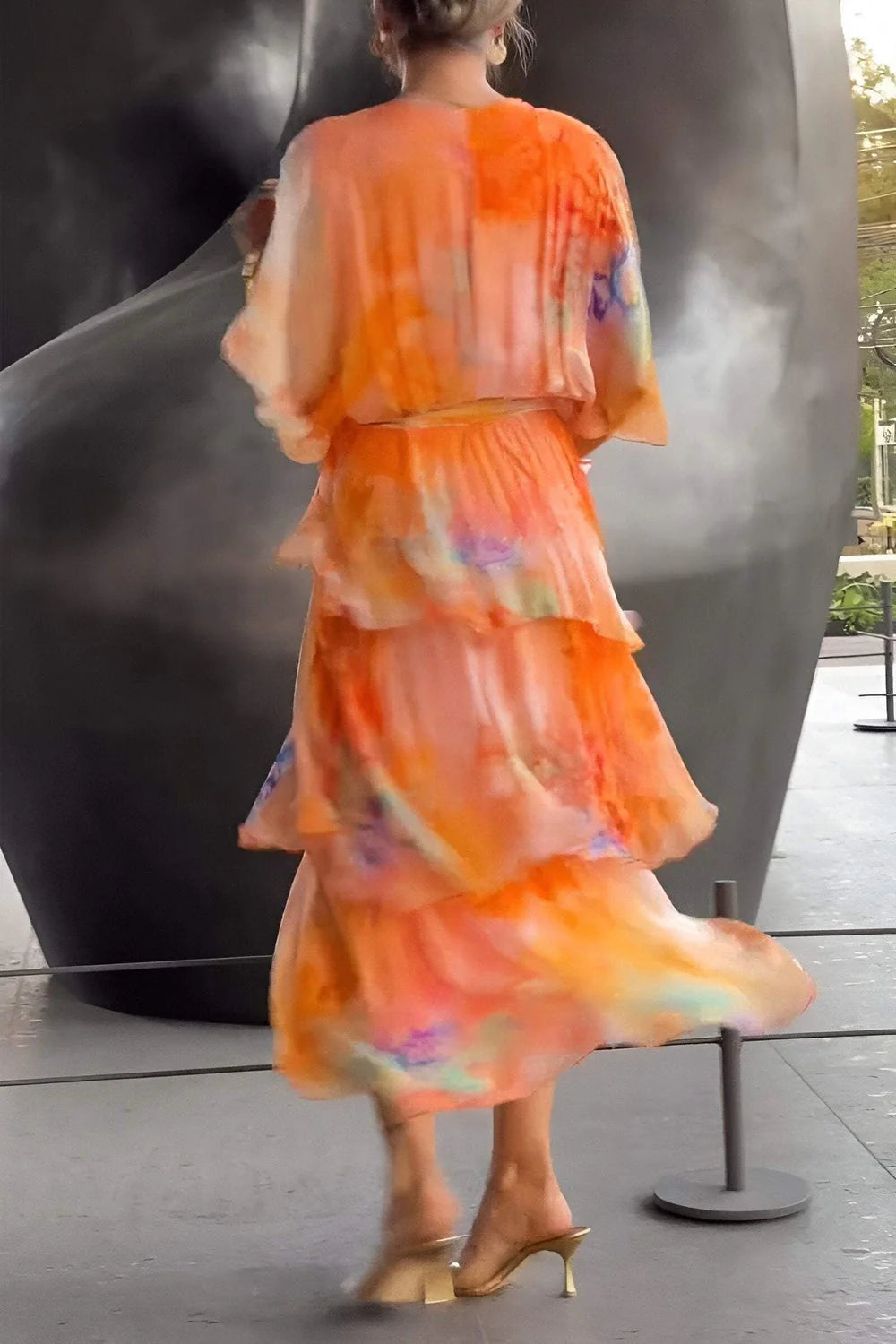 Close-up of Spring Floral Tiered Chiffon Dress waist tie and tier detail with soft floral pattern