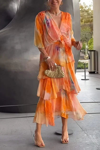 Side profile of Spring Floral Tiered Chiffon Dress displaying flowing maxi length and waist tie detail