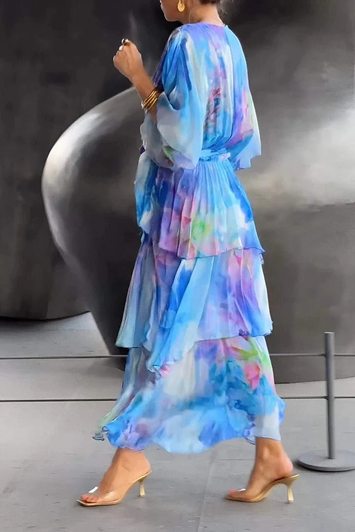 Back view of Spring Floral Tiered Chiffon Dress showing cascading tiers and flowing chiffon fabric