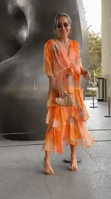 Spring Floral Tiered Chiffon Dress worn outdoors highlighting airy chiffon fabric and maxi silhouette