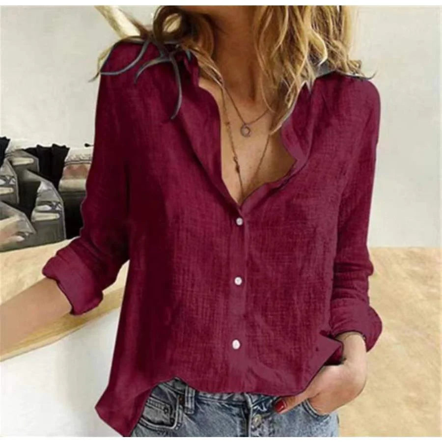 Close-up of women's cotton long sleeve shirt showing woven fabric texture and button details
