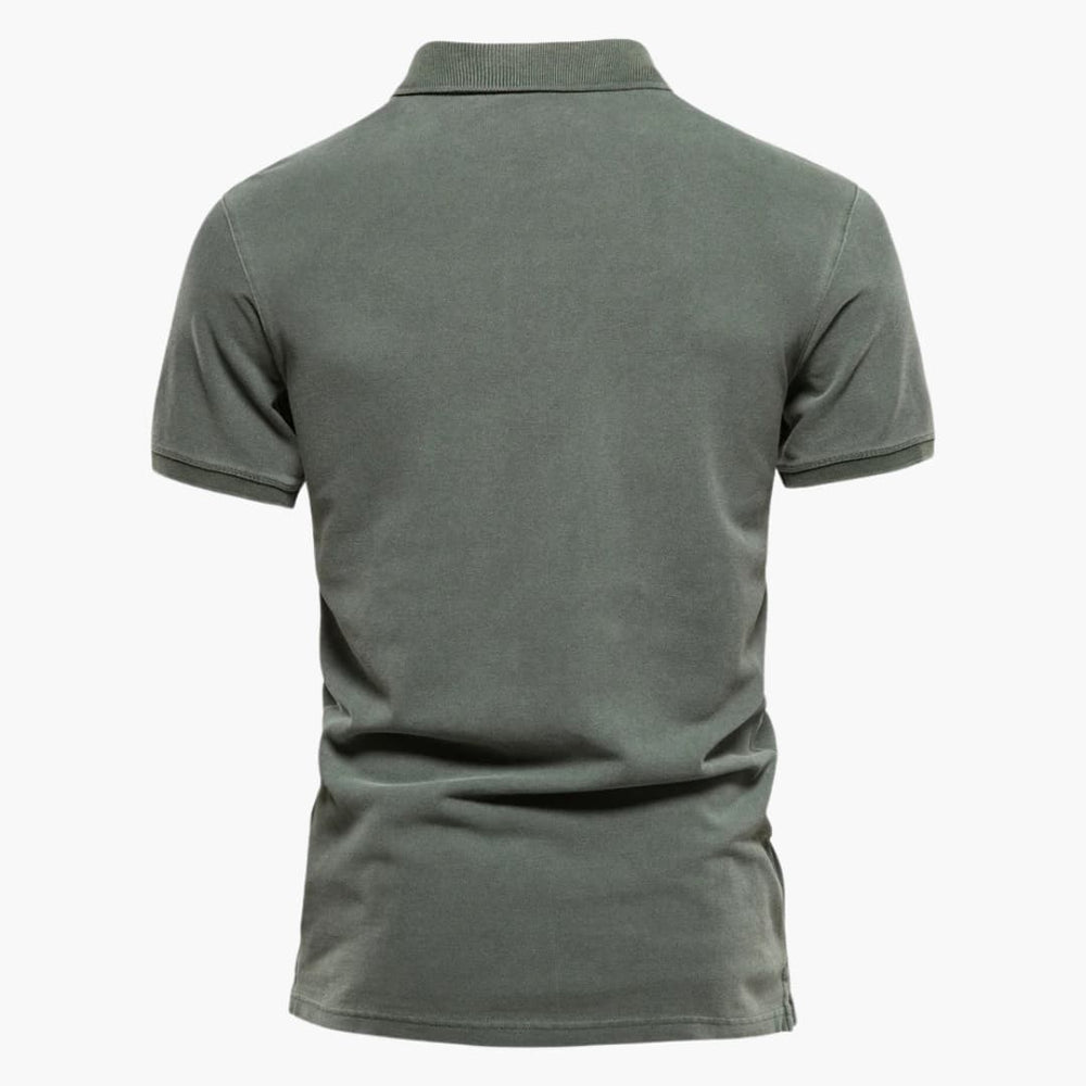 Close-up view of men's tapered fit polo shirt showing structured knit fabric and clean stitching details