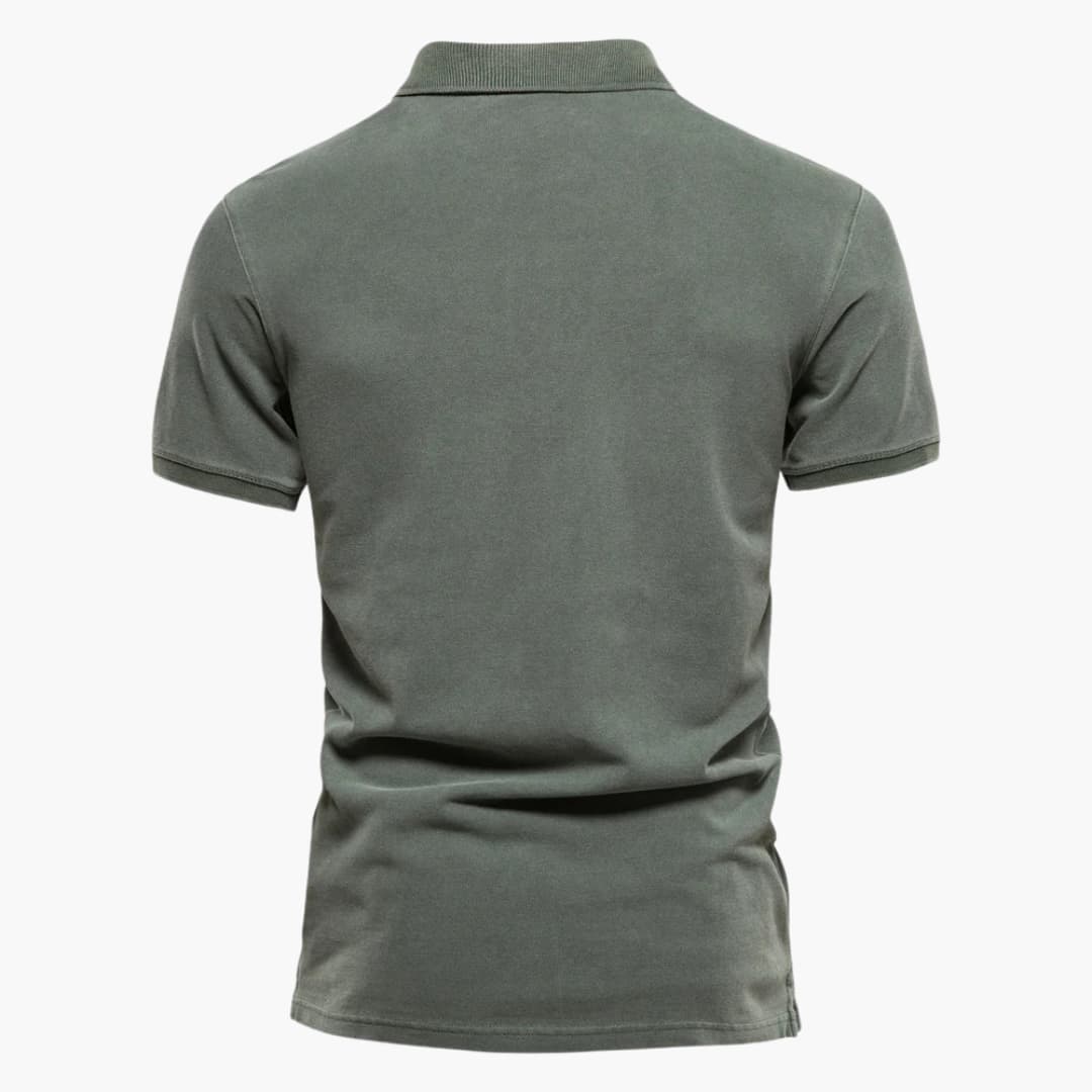 Close-up view of men's tapered fit polo shirt showing structured knit fabric and clean stitching details