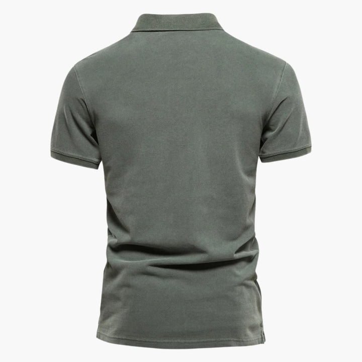 Close-up view of men's tapered fit polo shirt showing structured knit fabric and clean stitching details