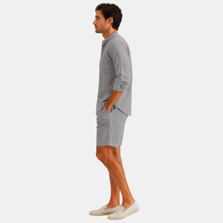 Men's coordinated two piece set featuring button-front shirt and drawstring shorts in gray