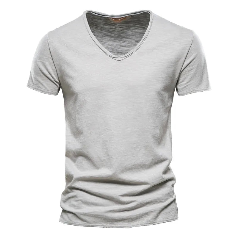 Side view of men's V neck cotton tshirt showing relaxed fit and hip-length hem