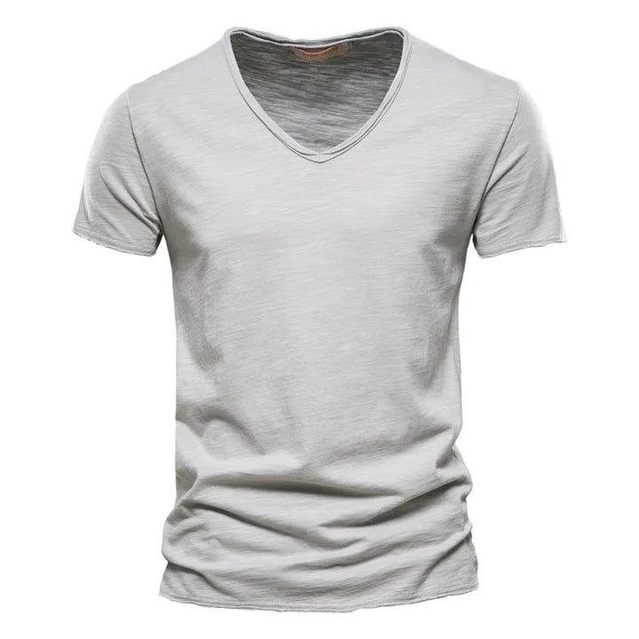 Side view of men's V neck cotton tshirt showing relaxed fit and hip-length hem