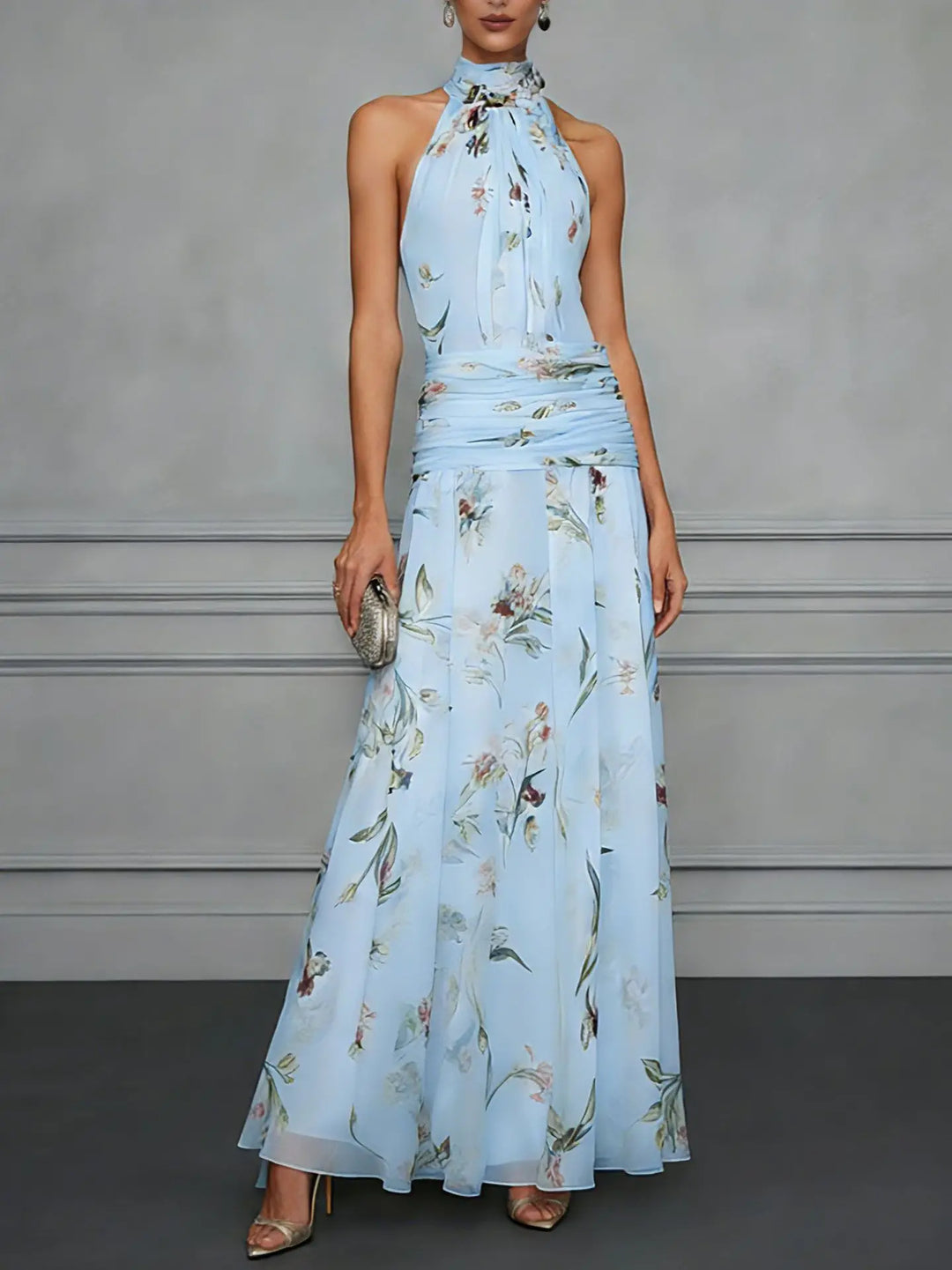 Floral halter maxi dress in pale blue with ruched waist and A-line skirt for wedding guest occasions