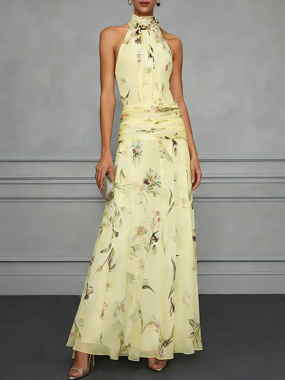 Side view of floral halter maxi dress showing flowy A-line silhouette and botanical print detail