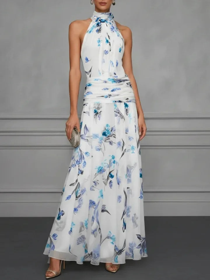 Back view of halter neck maxi dress with tie closure and flowing chiffon-like fabric drape