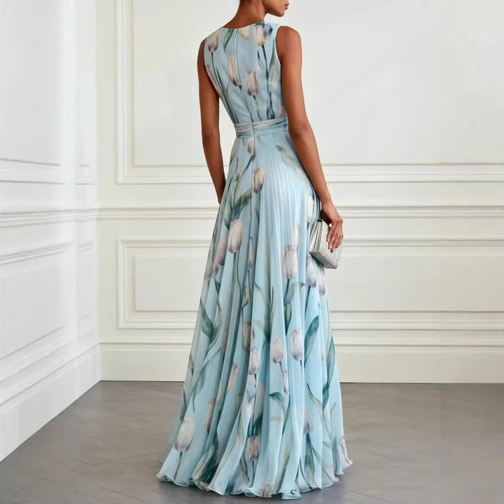 Back detail of sleeveless wedding guest dress with wrap-style bodice and tie waist