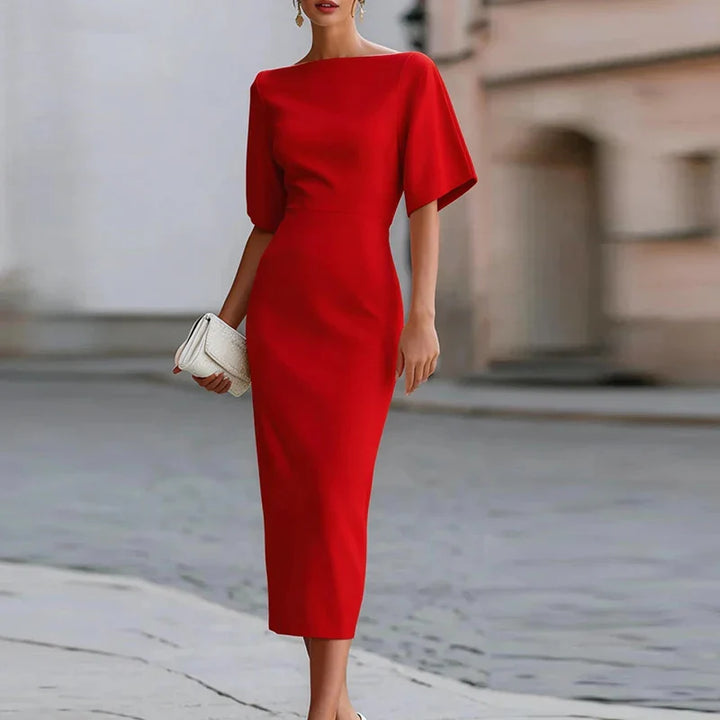 Close-up detail of boat neckline and short kimono sleeve construction on bodycon dress