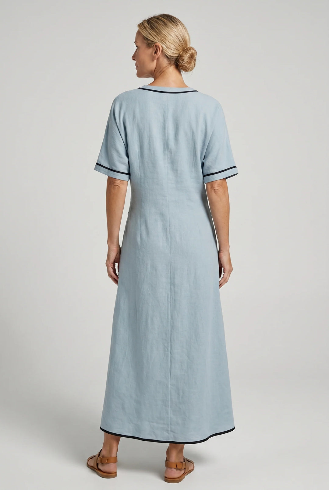 Full-length view of flowing maxi dress with relaxed short sleeves and ankle-length hem