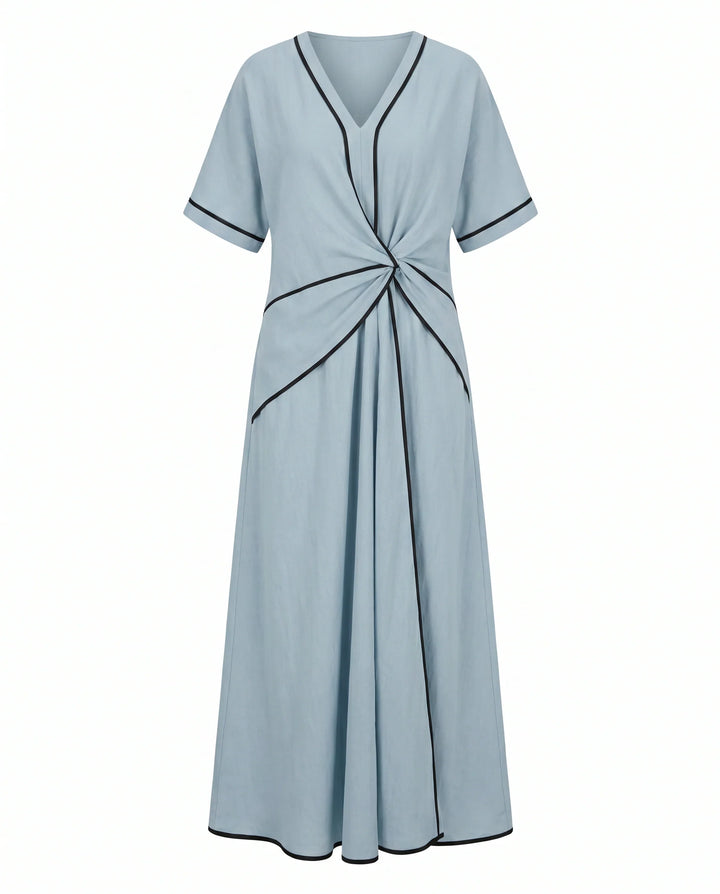Back view of maxi dress showing flowing A-line silhouette and contrast trim