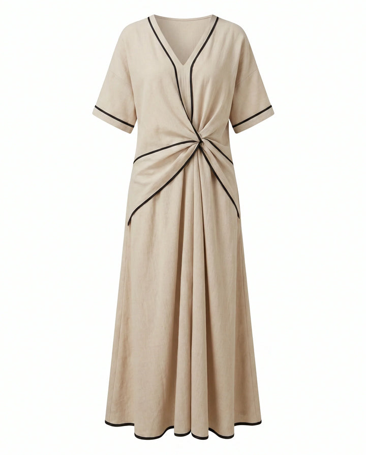 Woman wearing beige V-neck twist front maxi dress in relaxed summer setting