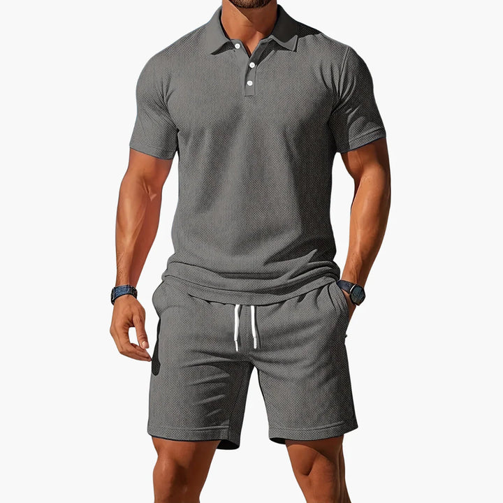 Back view of men's matching polo shirt and shorts set in solid color