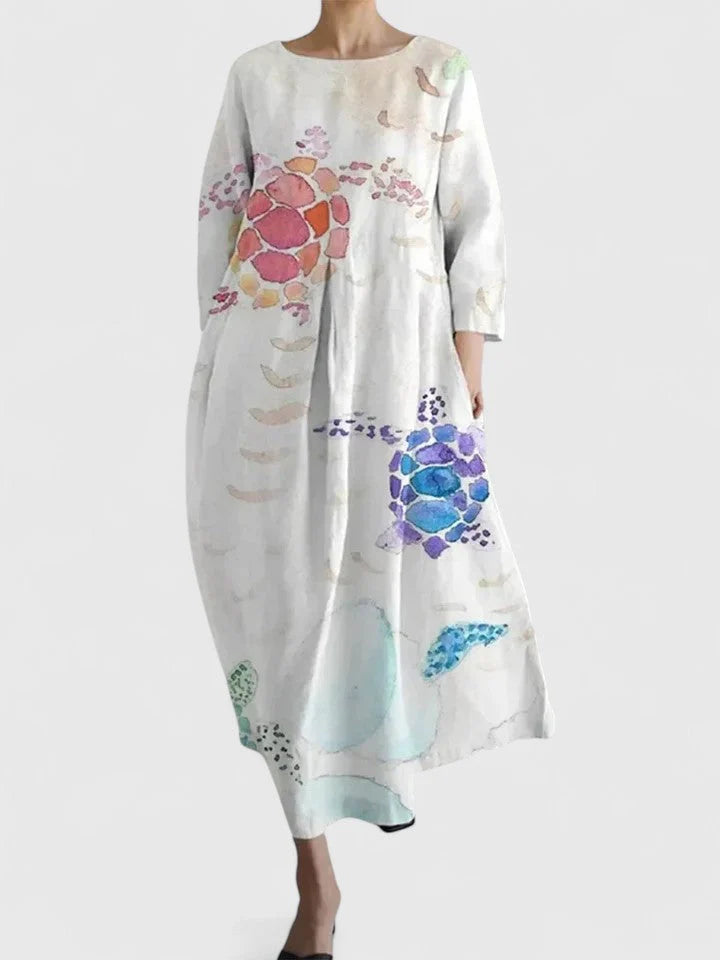 Summer cotton dress with colorful turtle print design and boat neckline in relaxed midi length