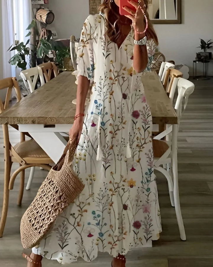 Back view of cotton summer dress showing flowing maxi length and short sleeve design