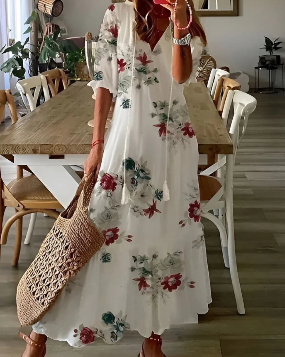 Cotton summer dress styled for warm-weather wear with bohemian print and tassel detail
