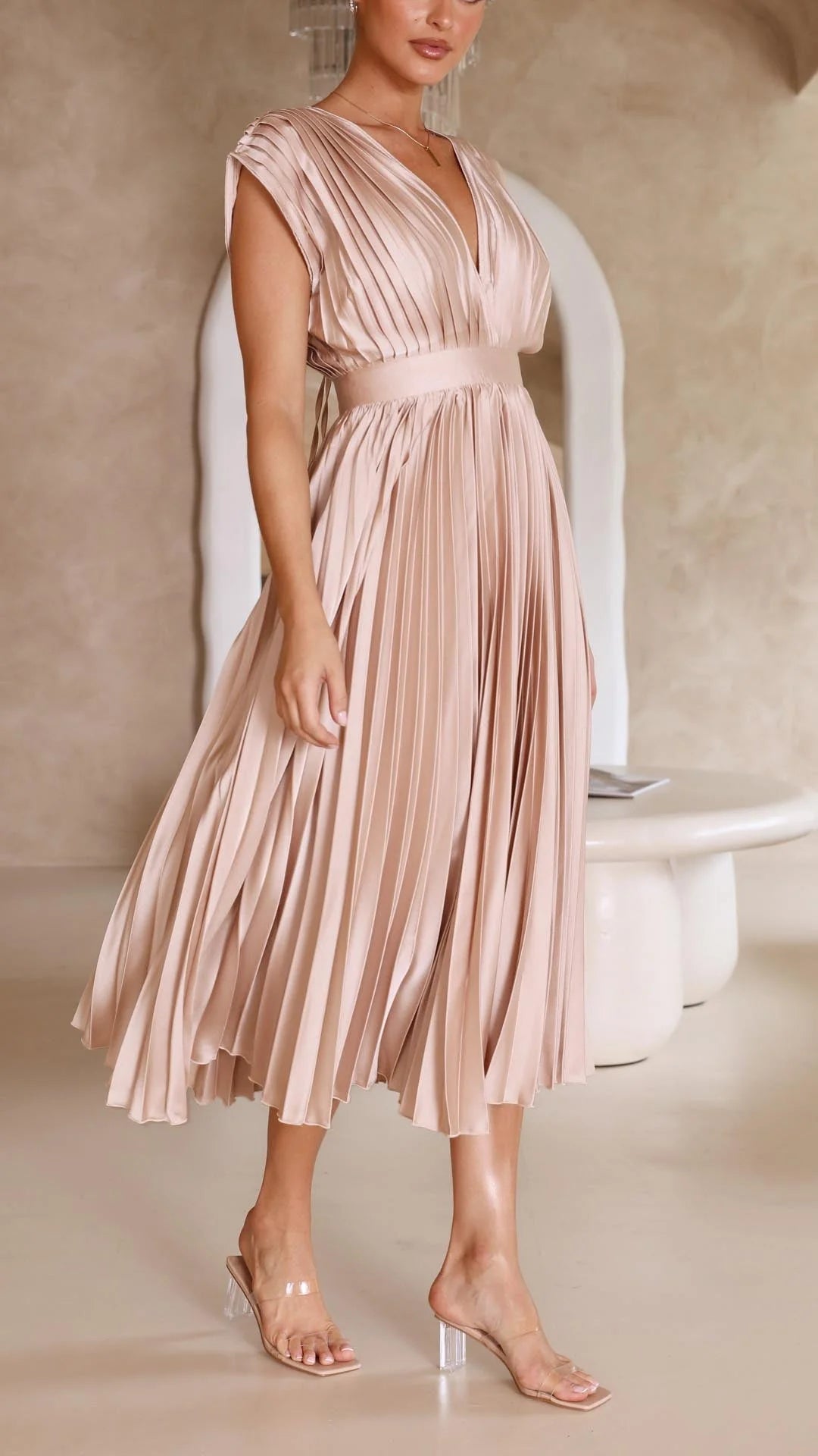 Three-quarter view of Elegant Pleated Maxi Dress V-Neck Flowing showing silhouette