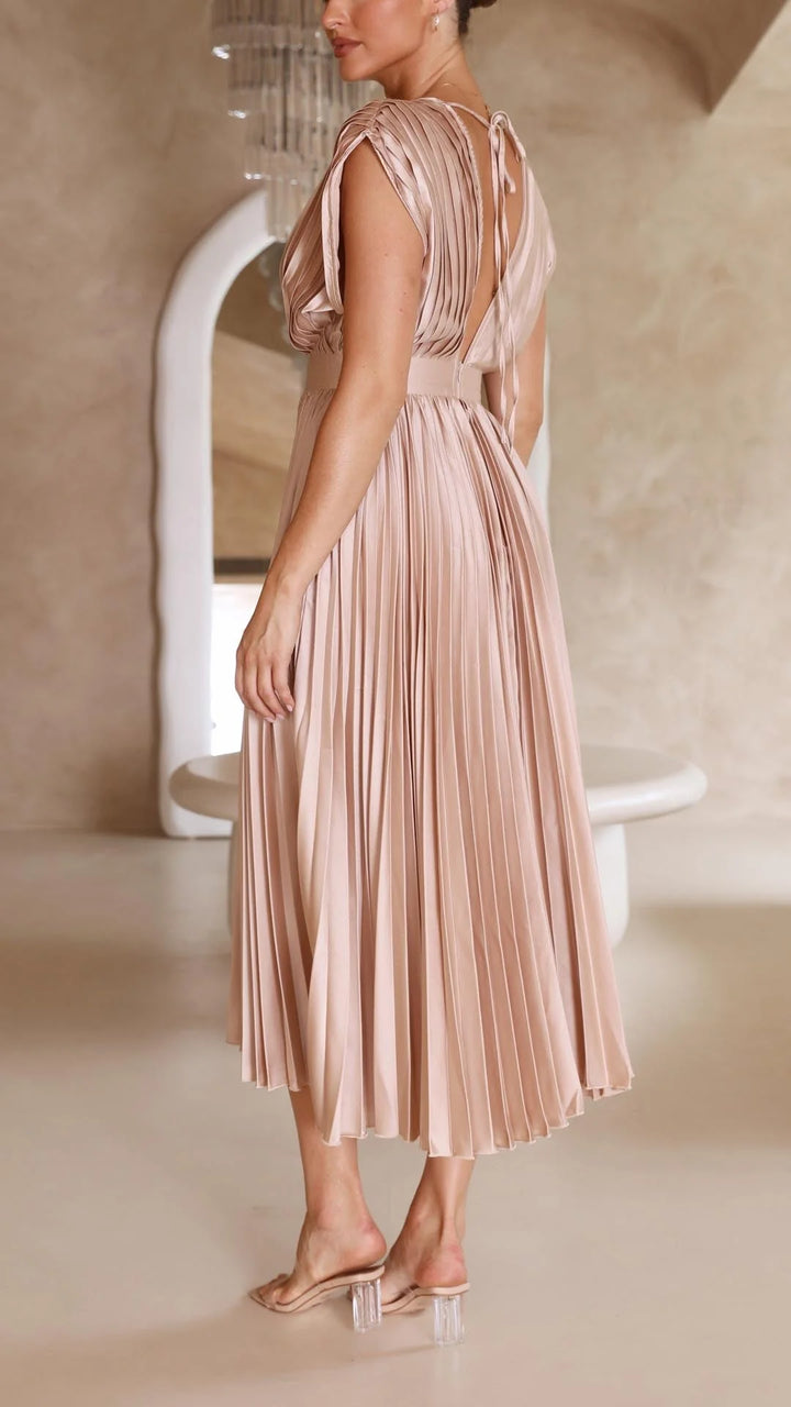 Detail of soft fabric drape and pleating on maxi dress bodice