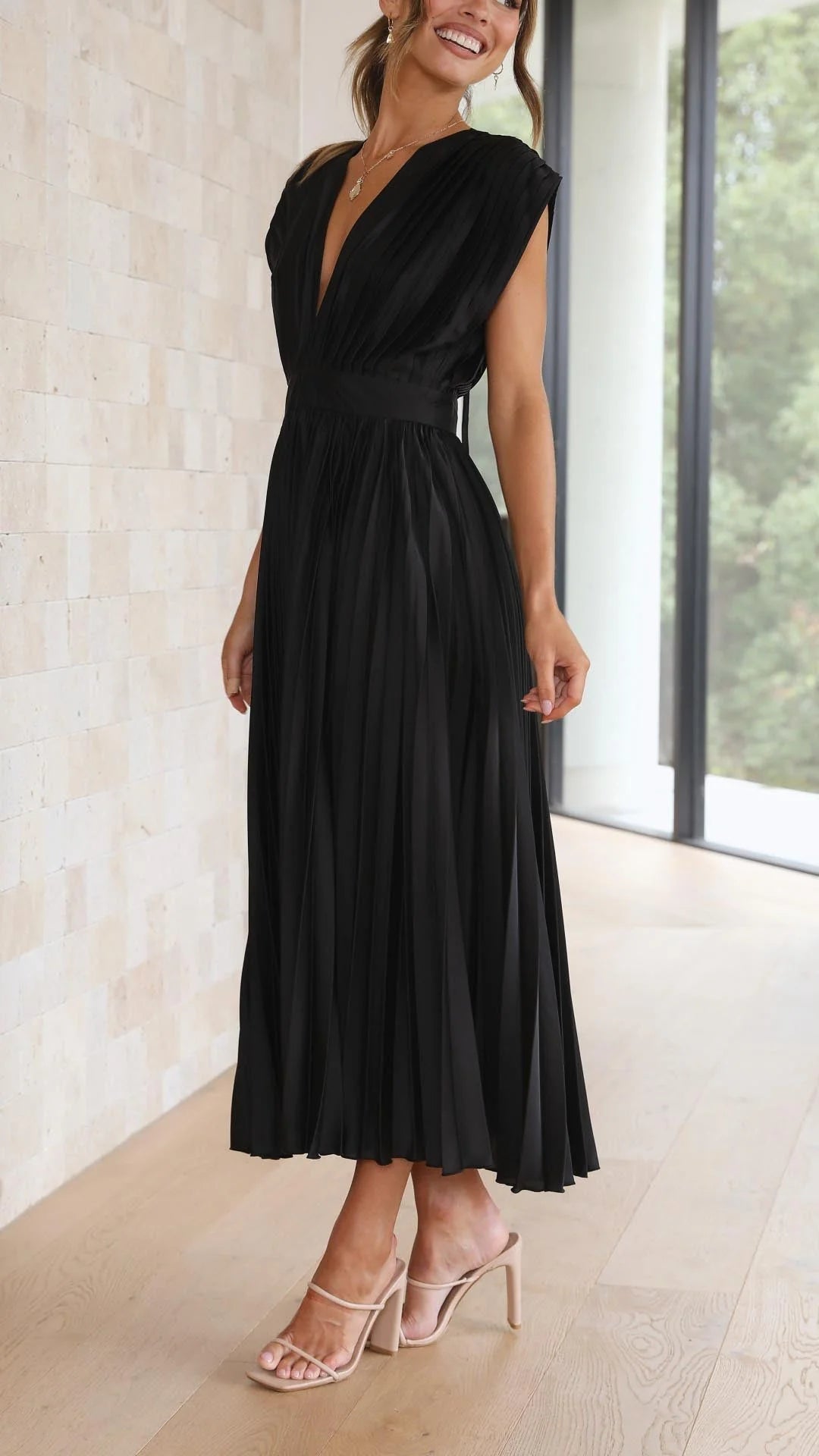 Elegant Pleated Maxi Dress V-Neck Flowing paired with strappy heels for evening