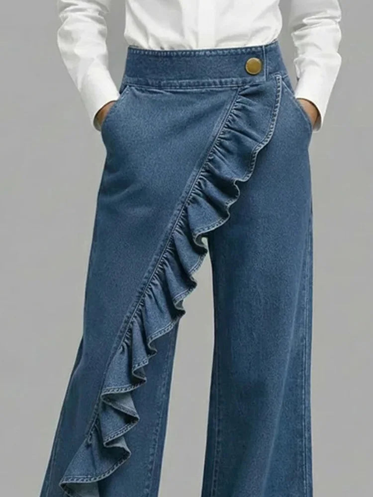 Side view of women's wide leg jeans showing flowing silhouette and cascading ruffle trim on left leg