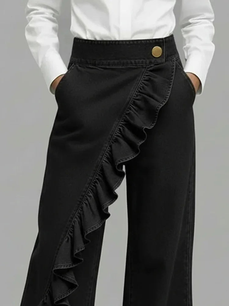 Detail shot of high-rise waistband with button closure on women's wide leg jeans