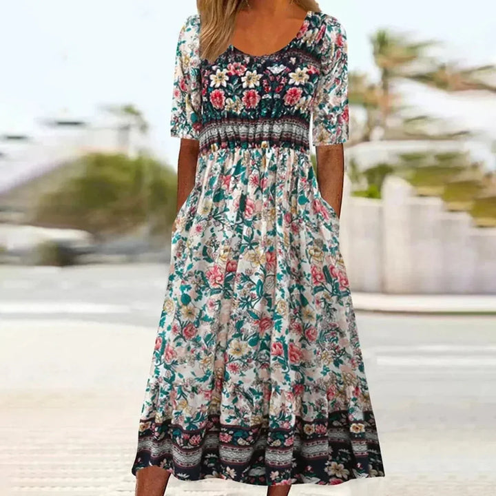 Flowing tiered boho dress in multicolor border print with square neckline
