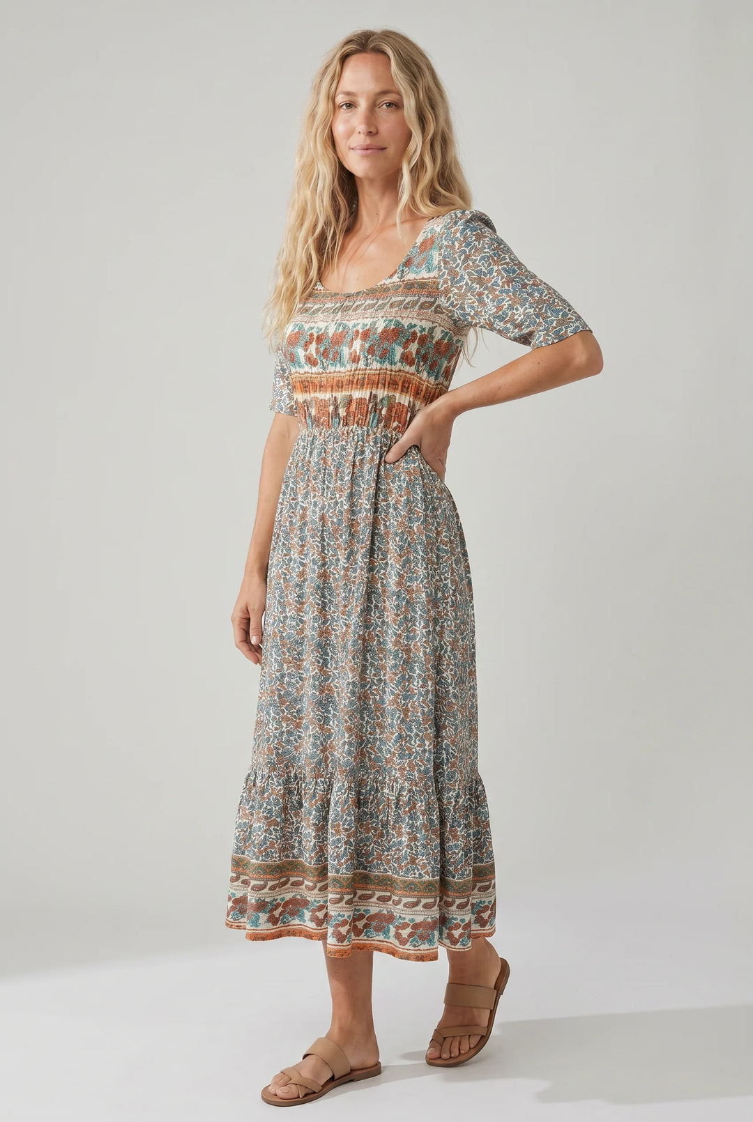 Tiered boho print dress with contrasting border patterns at chest and hem