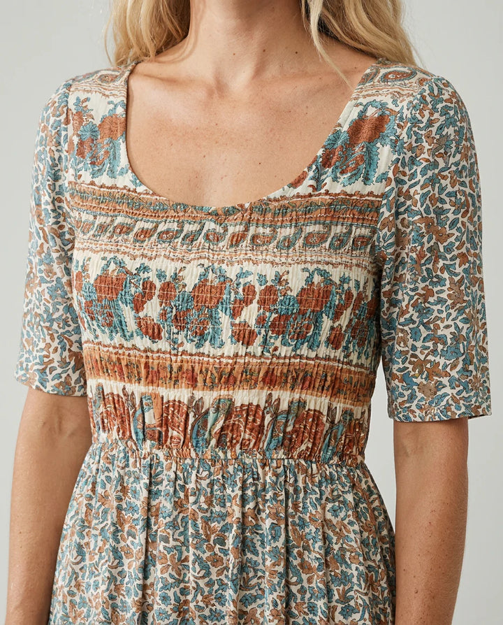 Mid-calf length boho dress with lightweight woven fabric and tiered construction