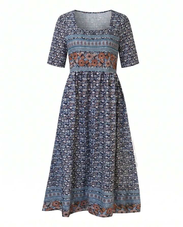 Flowing tiered skirt detail on boho print midi dress with border print hem