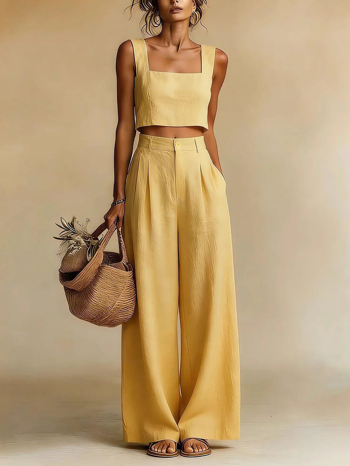 Woman wearing yellow Summer Pants Set with square neck crop top and wide leg palazzo pants for vacation styling