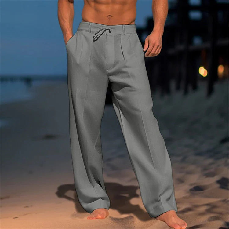 Side view of men's relaxed fit pants with drawstring waist and smooth woven fabric