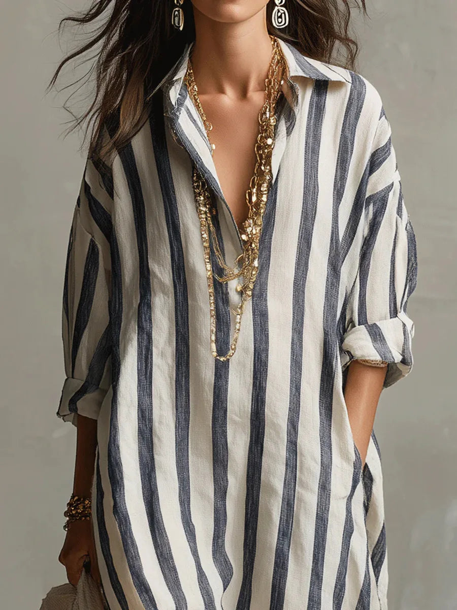 Close-up of collared V-neckline and button-front closure on striped kaftan shirt dress
