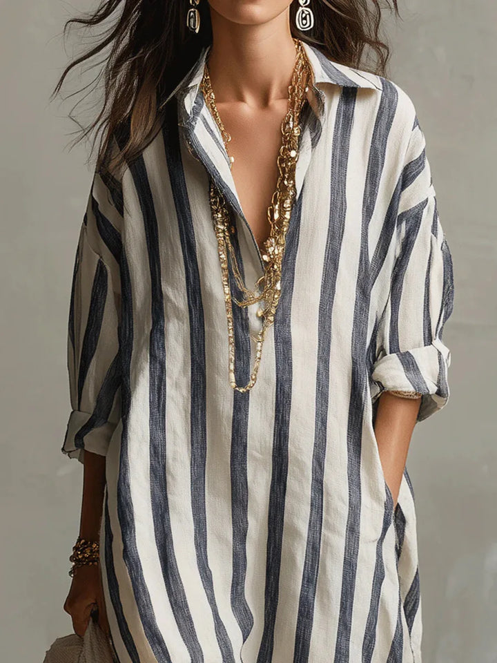 Close-up of collared V-neckline and button-front closure on striped kaftan shirt dress
