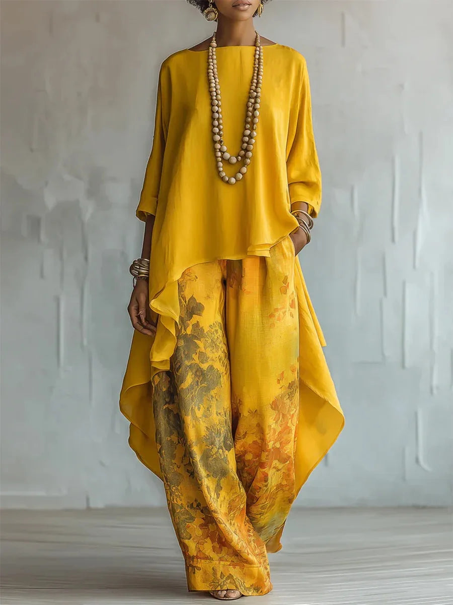 Woman wearing yellow Printed Loose Two-Piece Set with asymmetrical layered top and floral wide leg pants