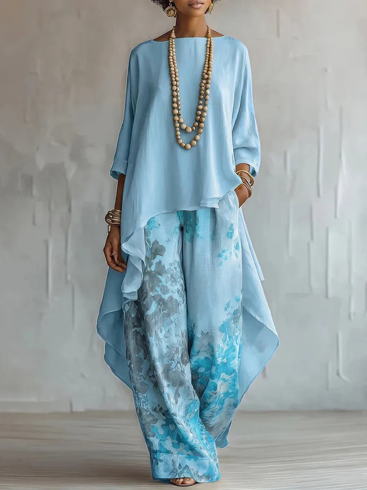 Detail shot of the three-quarter sleeves and soft draping fabric on the two-piece set top