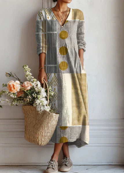 Boho Midi Dress with patchwork print featuring geometric patterns, V-neckline, three-quarter sleeves, and relaxed mid-calf length silhouette for women