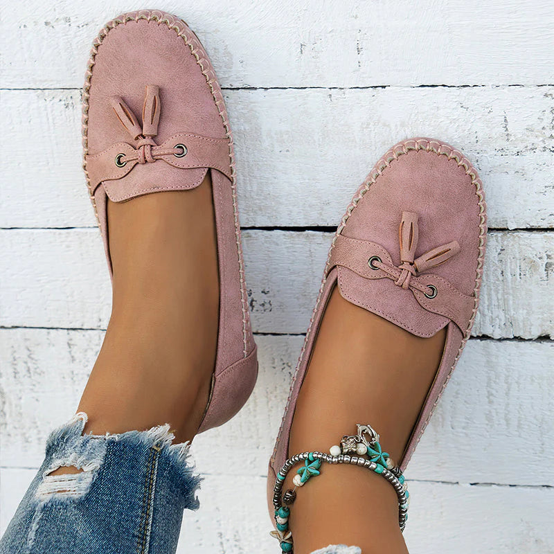 Slip-on loafers displaying classic moccasin construction and supportive footbed