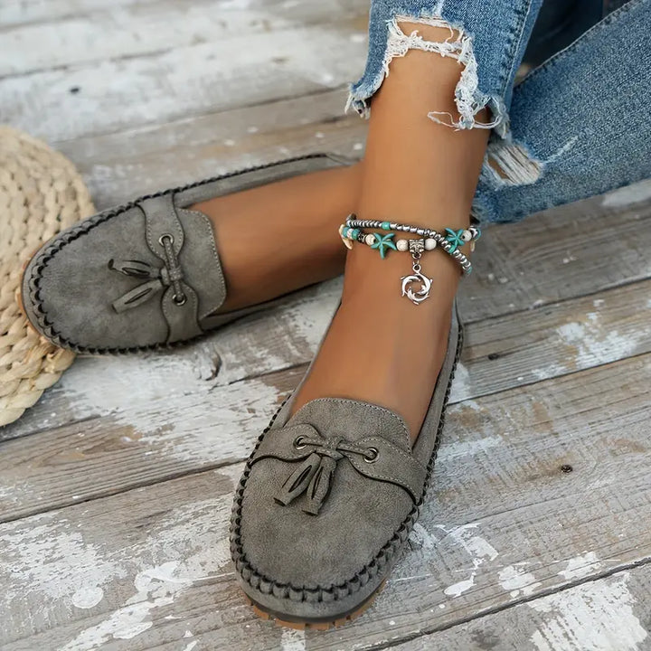 Side view of women's vintage loafers showing ergonomic sole and cushioned insole construction